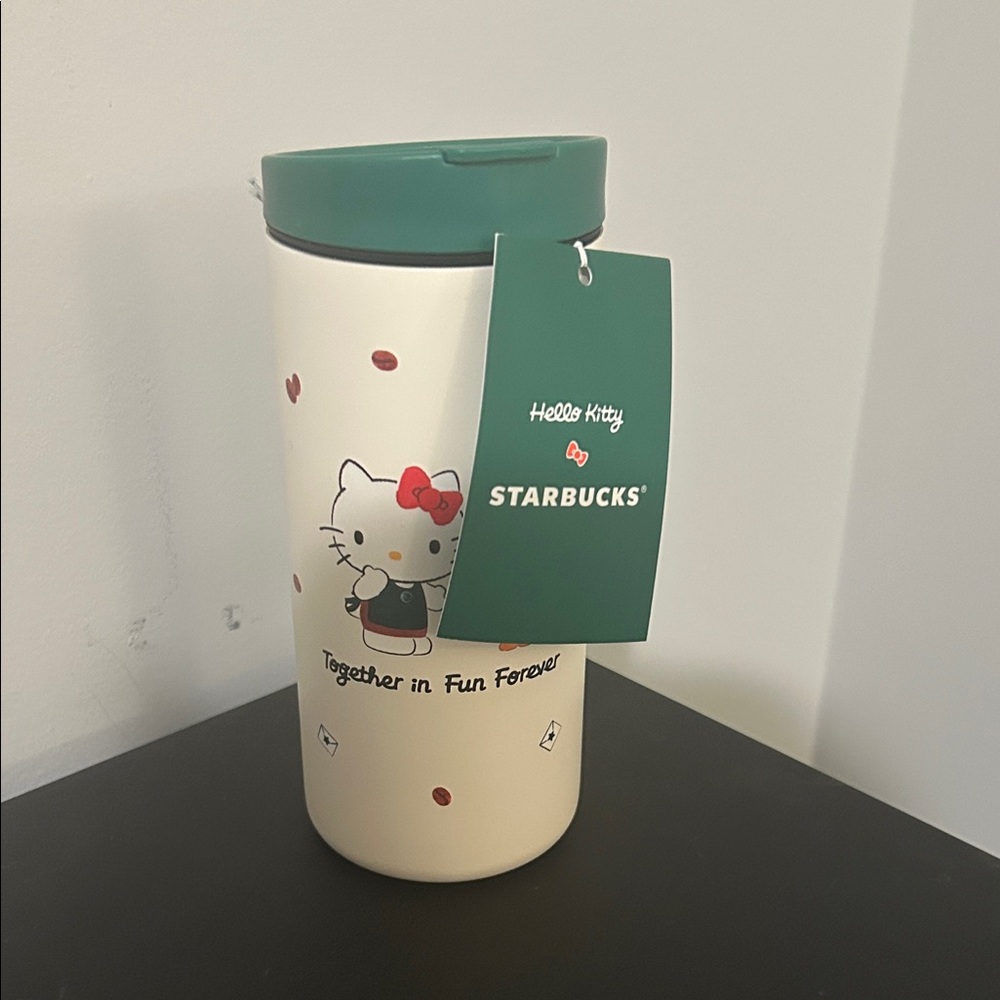 Starbucks Cream Tumbler with Green Lid and Hello Kitty Design